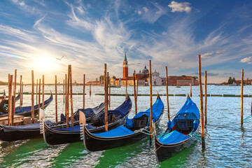 Fototapeta na wymiar The island of San Giorgio Maggiore and traditional gondolas of Venice, Italy