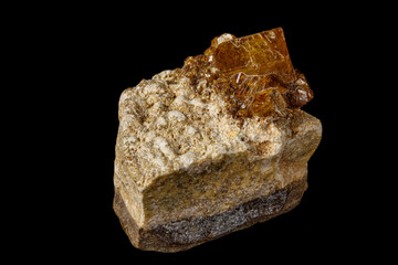 Macro stone Grossular mineral on a black background