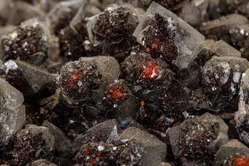 Macro of a stone Ilvaite mineral on a white background