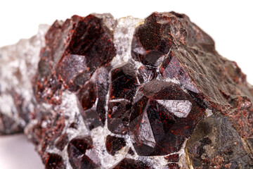 Macro stone garnet mineral on white background