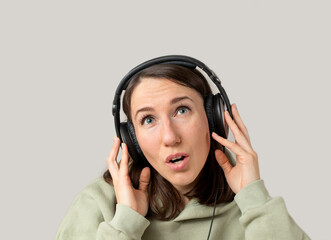 Young woman listening to music with headphones