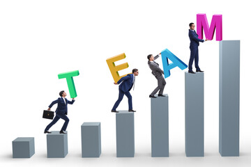 Teamwork concept with people carrying team letters