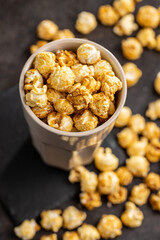Sweet caramel popcorn in cup.