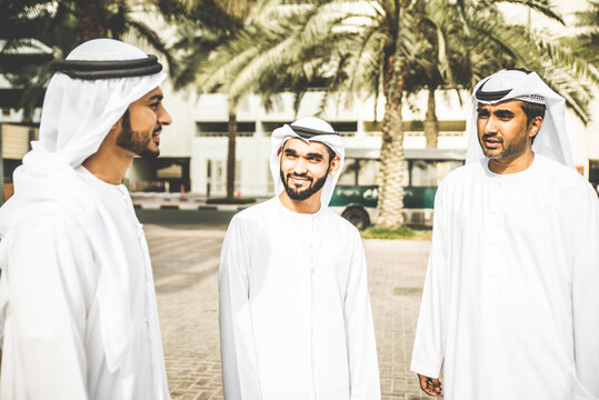 Three arabic business men discussing and spending time in Dubai