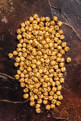 Fried chickpeas with turmeric, roasted spicy chickpeas or Indian chana or chole. Dark background. Top view