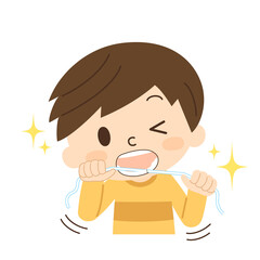 歯のフロスをする男の子