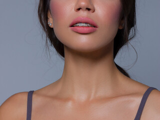Close-up of sexy female lips with tongue. Clean skin and a clear lip contour are outlined with a...