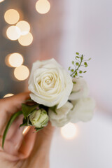 White rose boutonniere for the groom
