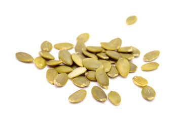 Hulled pumpkin seeds isolated on white background
