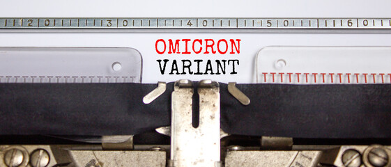 Covid-19 new omicron virus variant symbol. Concept words Omicron variant typed on retro typewriter....