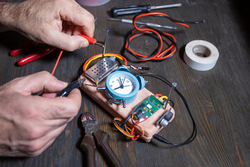 bomb maker constructing homemade device
