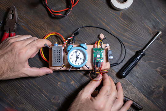terrorist constructing homemade bomb