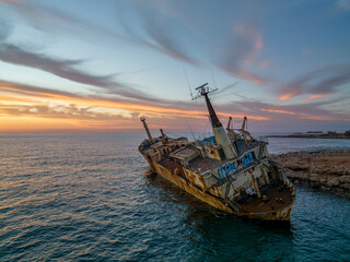 Cyprus - Abandoned shipwreck EDRO III in Pegeia, Paphos, Cyprus from drone view at amazing sunset...