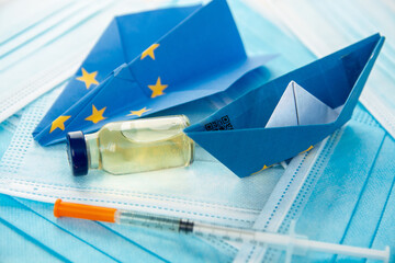  green pass qr code, vaccine ampoule and syringe, face mask, paper plane in EU european union flag...