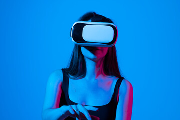 Female engineer wearing virtual reality headset designing a new pruducts or technologis using VR technology. Development and prototyping software.
