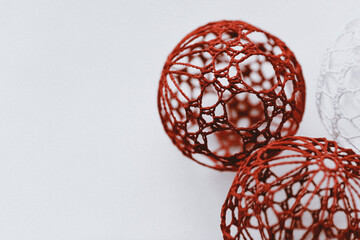 Christmas ball with macrame-style weaving,handmade decor in eco-style,hands close-up,top view. Christmas, New Year and eco-friendly concept