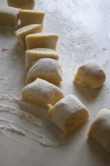 dough and flour on the table. cooking gingerbread. knead the dough to make a pie. grandmother prepares a cupcake. mom makes sweets.