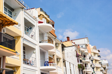 Upper floors of white buildings