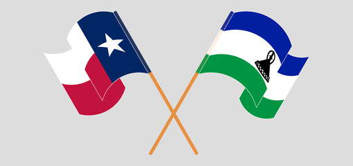 Crossed and waving flags of the State of Texas and Kingdom of Lesotho