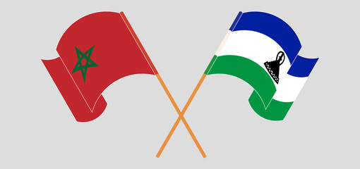 Crossed and waving flags of Morocco and Kingdom of Lesotho