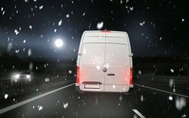 Christmas Parcel Carrier Courier - Van Transporter at night in winter on the road with snow at...