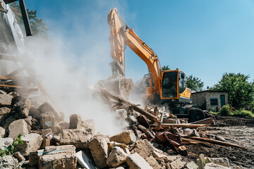 Excavator destroy old house. Demolition of building.