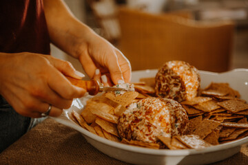 Cheese ball at a holiday table with crackers 