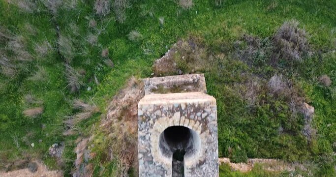 An aerial video of a medieval aqueduct in rural Cyprus used to transfer water to plantations and Olive trees