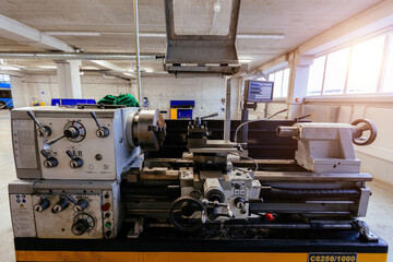Modern lathe with CNC in the metalworking workshop