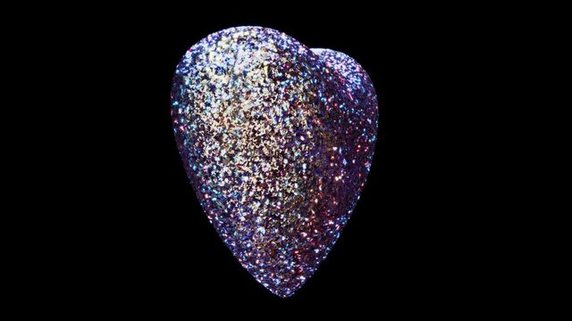 Realistic seamless looping 3D animation of the spinning silver metallic sequin colorful heart rendered in UHD with alpha matte