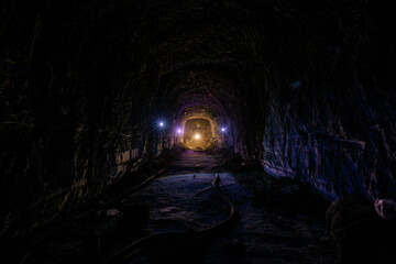 Dark creepy old abandoned mine in backlight