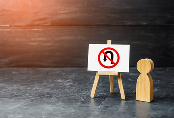 Men near no turning back traffic sign easel. Turn arrow and red prohibition symbol. Assertiveness and striving, moving forward without retreating. Finish goals. Obstinacy, irrevocability. No way back.