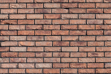 Facade of a building with red brick wall.