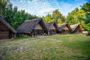 Fototapeta na wymiar Biskupin, Poland - August 09, 2021. Archaeological site and a life-size model of a late Bronze Age fortified settlement in north-central Poland