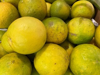 Sour oranges close up on display