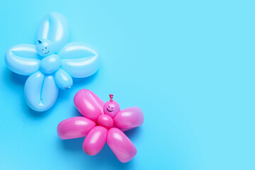 Butterflies made of balloons on blue background