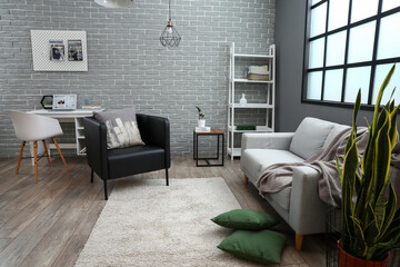 Black armchair and modern workplace in interior of living room