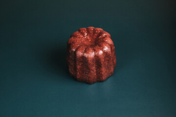 Caneles vanilla dark rum flavor traditional French sweet dessert with dark background. French Pastry