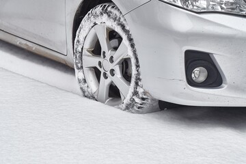 Car tyre in snow