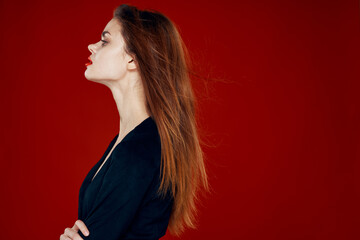 Fototapeta premium pretty woman with red lips red hair Glamor posing red background