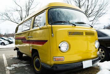 Classic vintage yellow Volkswagen Transporter camper van parked in Portsmouth NH