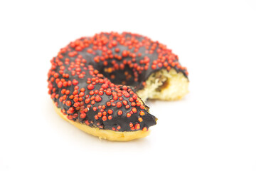 Bitten donut with frosting and filling isolated on white background.