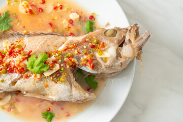 Steamed grouper fish with lime and chillies