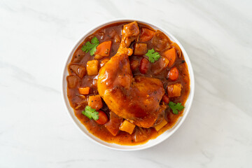 chicken stew with tomatoes, onions, carrot and potatoes