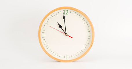 White wall clock isolated 11.00 am or pm. on white background.