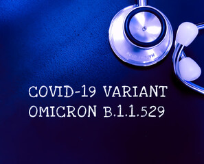 Covid-19 Variant Omicron b.1.1.529 text on blackboard with stethoscope. african variant.