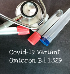 Covid-19 Variant Omicron b.1.1.529 text on blackboard with stethoscope. african variant.