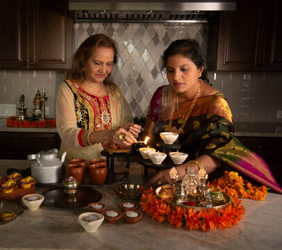 Women prepping for Diwali 