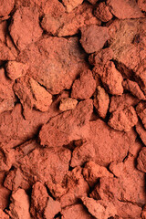 abstract of red clay soil, copper oxide contained rock in deep red color tone, closeup background,...
