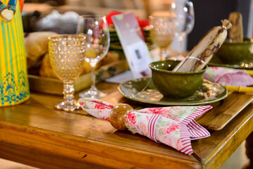 table set for breakfast, northeastern breakfast, coffee with brown sugar, wooden napkin holder, glasses for water and wine, rustic set table